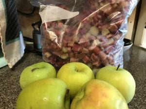 Frozen diced rhubarb and Granny Smith apples. Clean and peel apples to prepare for coring.