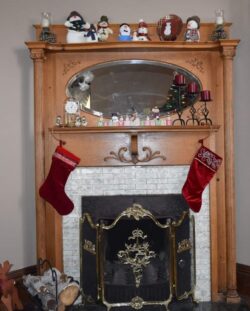 fireplace hung with red stockings for Christmas