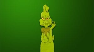 The Grinch with folded arms in front of dark green background